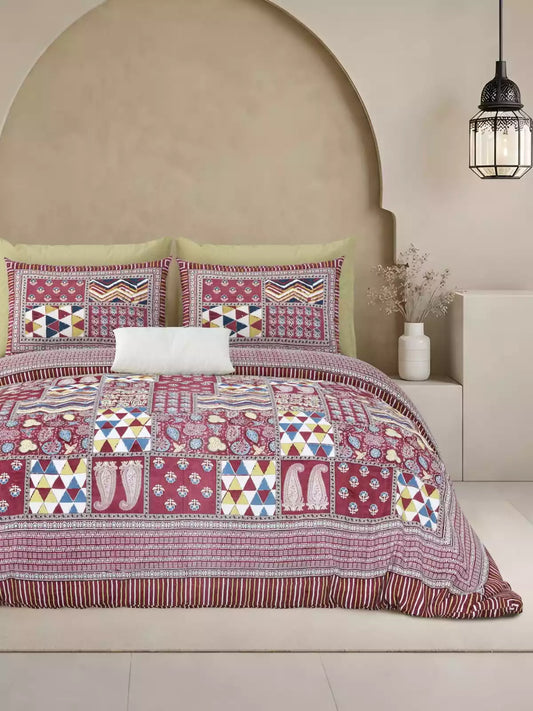 Jaipuri block print cotton bedsheet displayed on a bed with two matching pillow covers in a stylish setting.