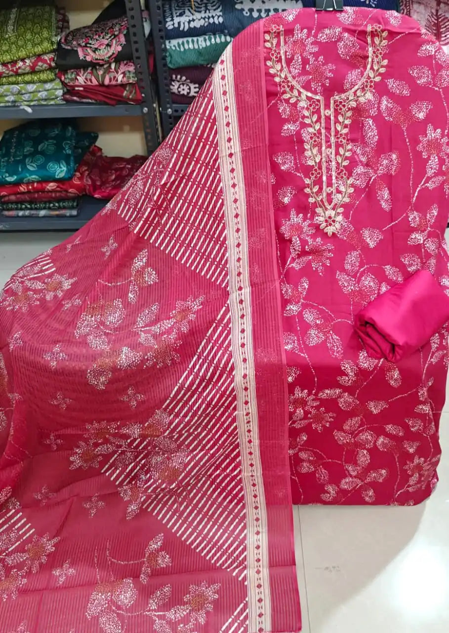 Pink floral unstitched suit with heavy embroidered neck patch and cotton dupatta displayed elegantly.