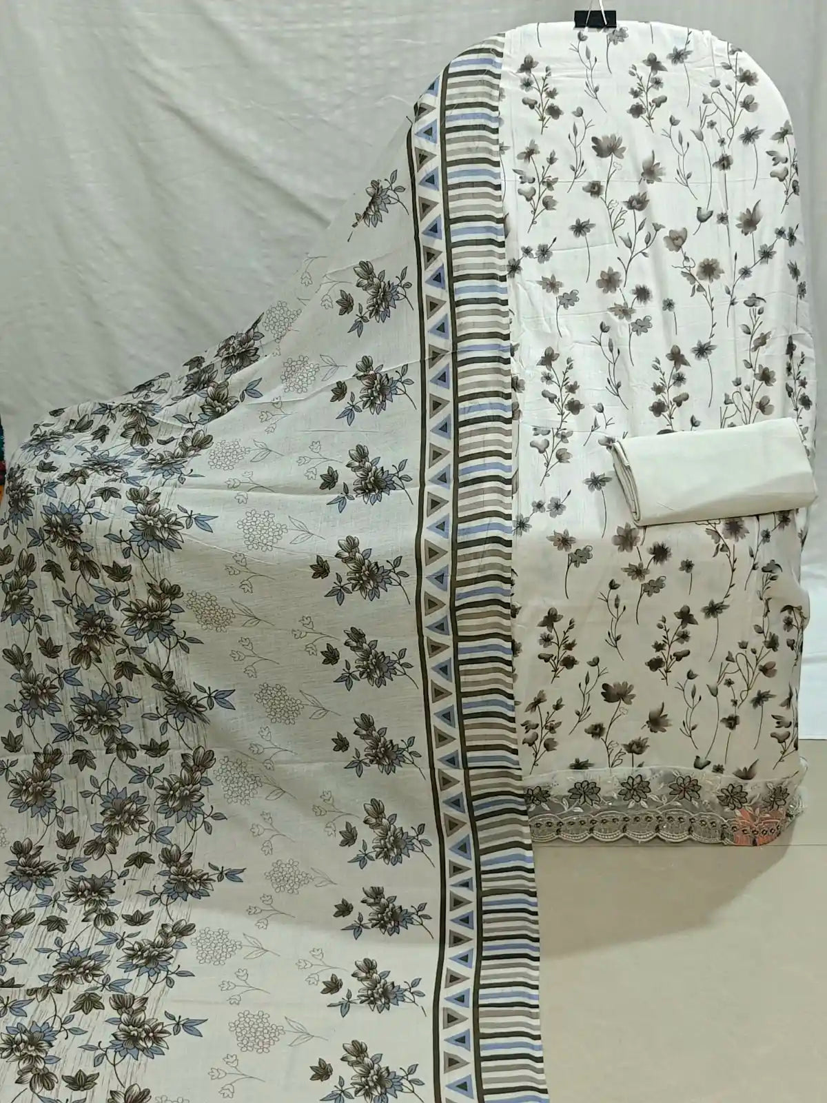 Cream base printed subtle Grey Top and Bottom Solid Off-White with printed dupatta Unstitched suit
