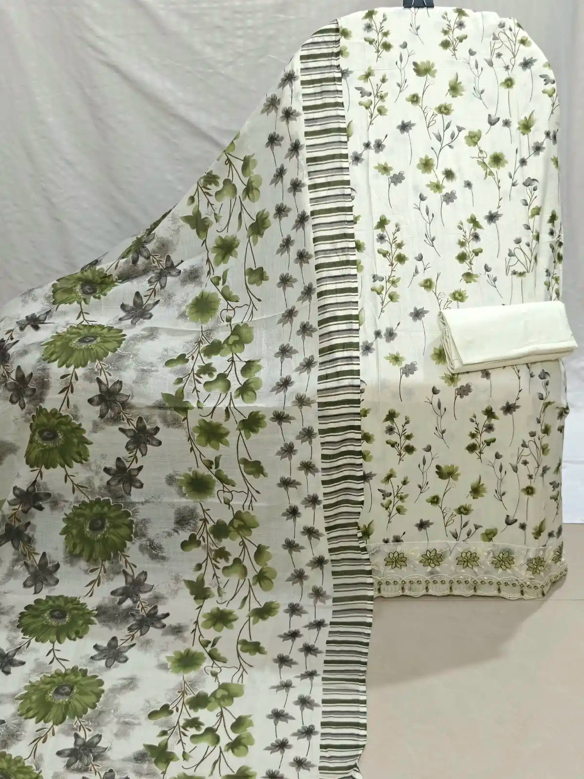 Cream base Printed Top & Teal Green floral print & embroidered border.