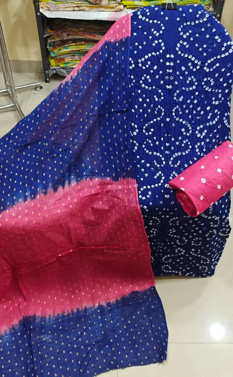 Deep royal blue cotton bandhani dress material with white traditional rings, paired beautifully with a dual-tone magenta pink and blue dupatta.