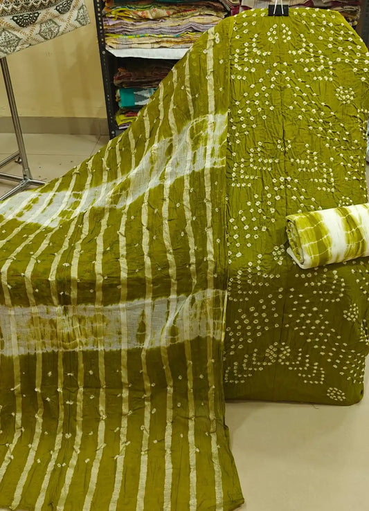 Deep wine-colored cotton bandhani dress material showcasing bold oval tie-dye rings, paired beautifully with an olive green contrast dupatta.