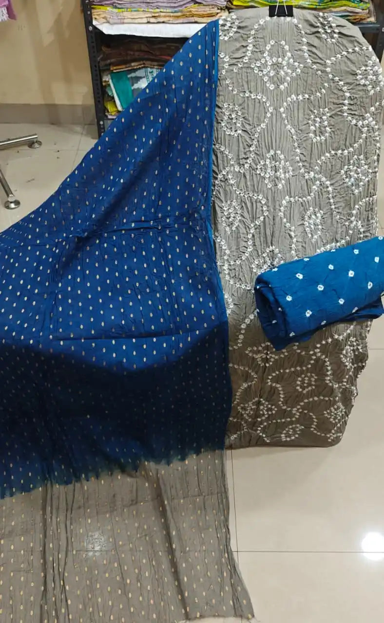 Modern grey mal cotton bandhani suit material with elegant white tie-dye prints, accompanied by a vibrant teal blue contrast dupatta.