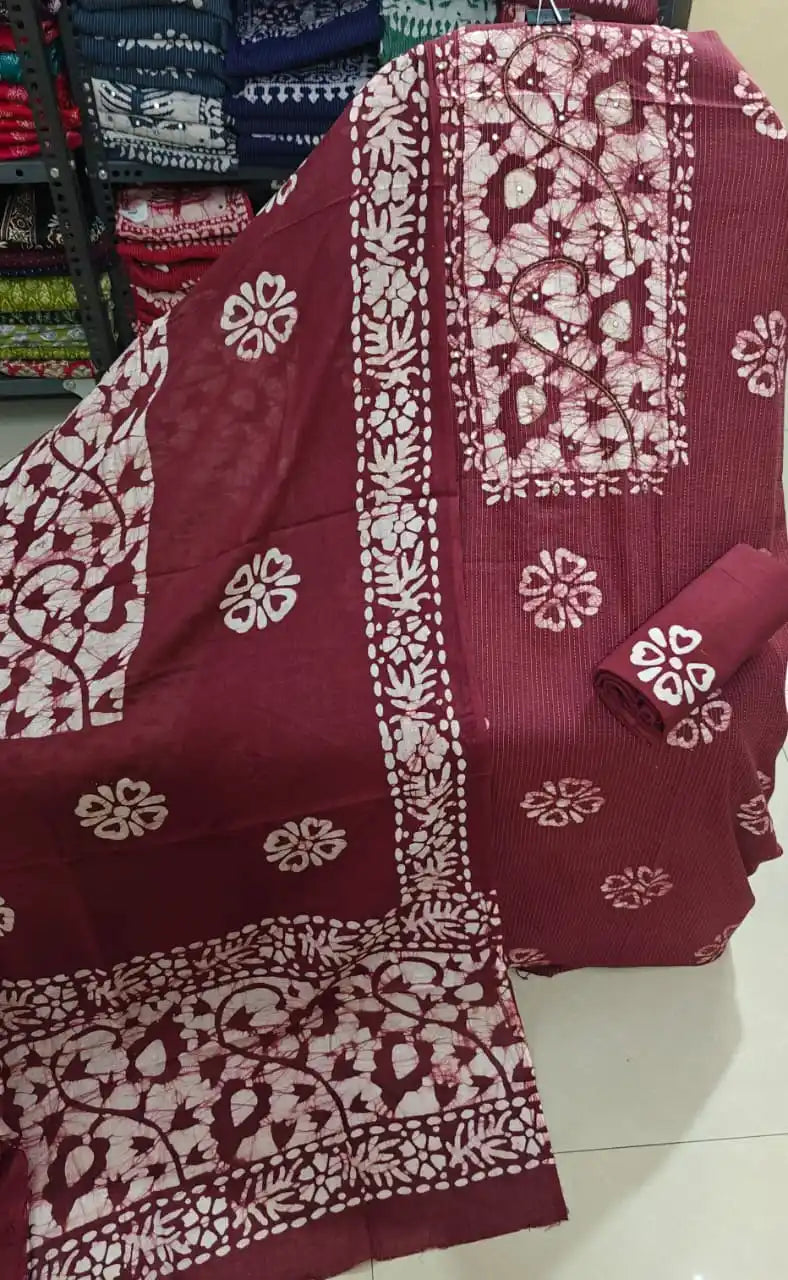 Maroon unstitched cotton batik dress material showing beautiful intricate floral vine and leaf designs by ASC Fashion Store.