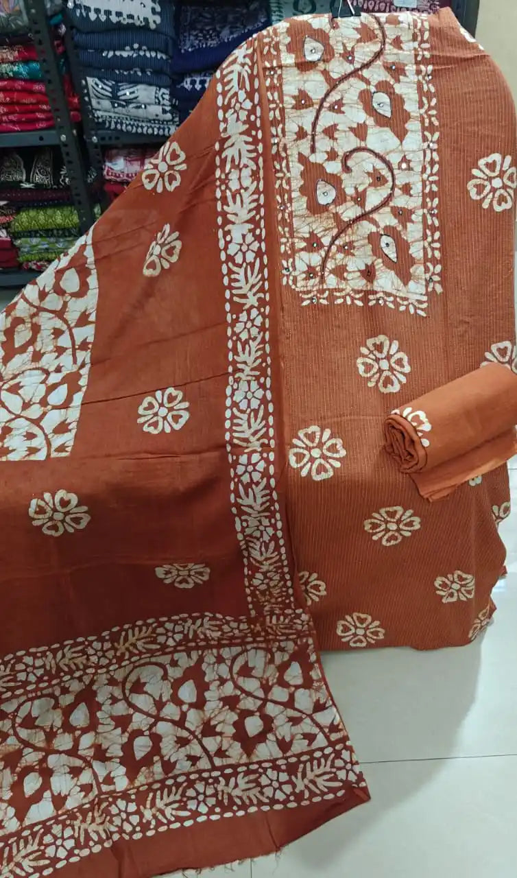 Terracotta rust orange unstitched batik dress material with embroidered neck border and matching salwar set from ASC Fashion Store.