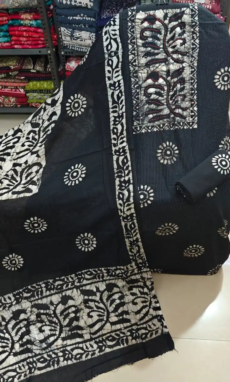 Black unstitched ladies batik dress material with elegant white floral patterns and an embroidered neck frame from ASC Fashion Store.