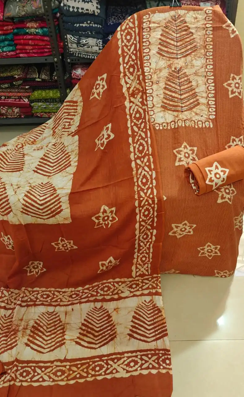 Earthy rust orange unstitched cotton batik salwar suit material with traditional hand block print accents by ASC Fashion Store.