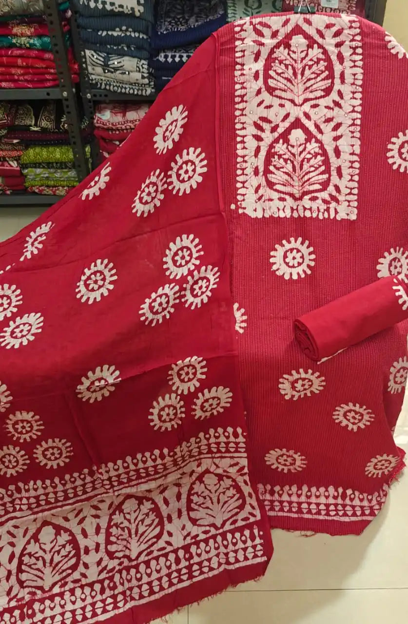 Bold red unstitched cotton batik suit material featuring handcrafted traditional white motifs from ASC Fashion Store.