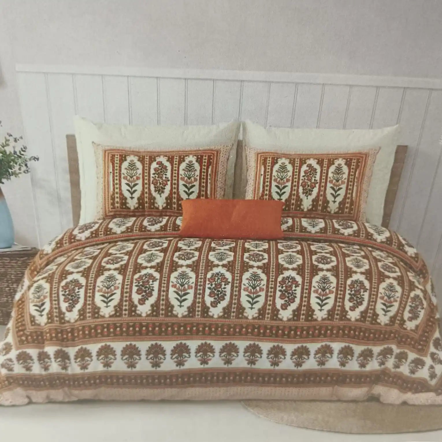 Luxury floral 9x9ft bedsheet displayed on a bed with decorative pillows in a stylish bedroom setting.