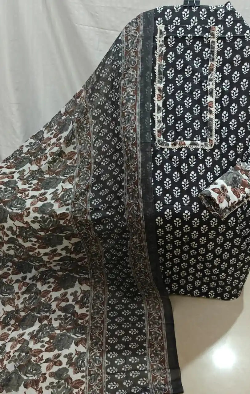 A striking display of a black cotton unstitched dress material by ASC, featuring clean white booti prints, a structured rectangular neck patti, paired beautifully with a black and cream floral vine printed dupatta.