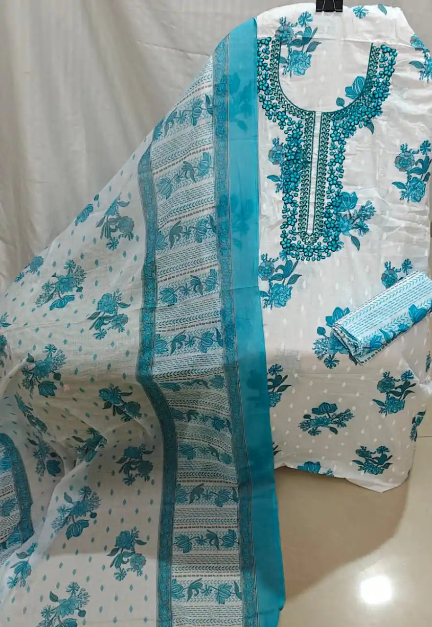A clean display of a white cotton unstitched dress material by ASC, featuring teal blue floral bootis, an intricately embroidered turquoise round neck border, and a matching printed dupatta.
