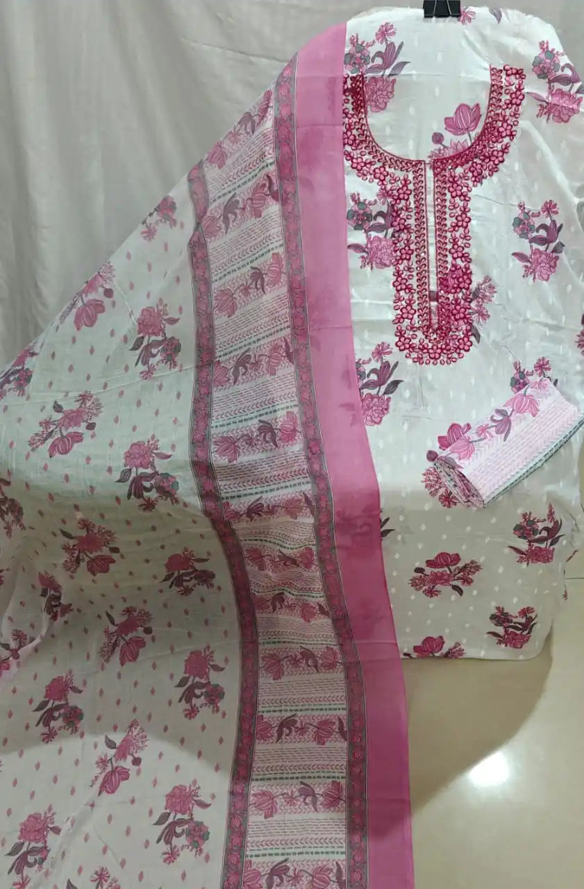 A neat flat lay of a white cotton unstitched dress material by ASC, showing bright pink floral prints, a detailed pink embroidered split neck panel, and a coordinated soft dupatta.
