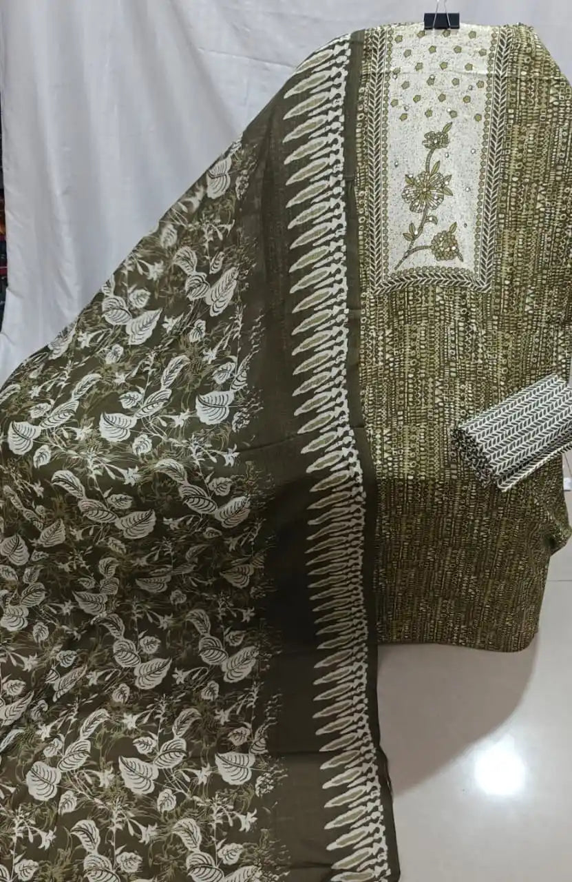 A detailed look at an olive green cotton unstitched dress material by ASC, featuring fine geometric dash prints, a prominent off-white chest panel with embroidered leafy twigs, and a dark olive dupatta with cascading leaf prints.
