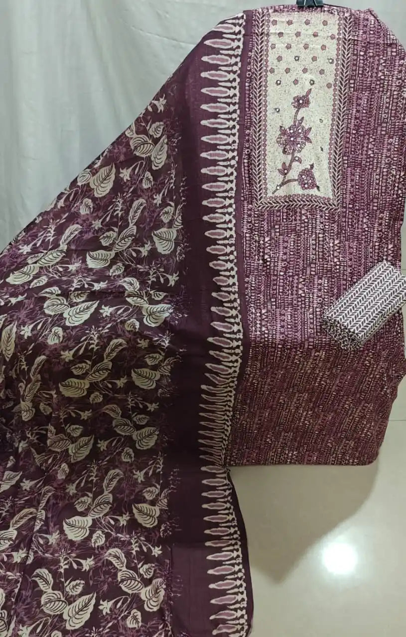 A neat presentation of a wine-colored cotton unstitched suit fabric by ASC, showcasing all-over micro geometric texture prints, a contrasting cream chest panel with fine floral stem embroidery, and a matching rich wine dupatta with white leafy vines.