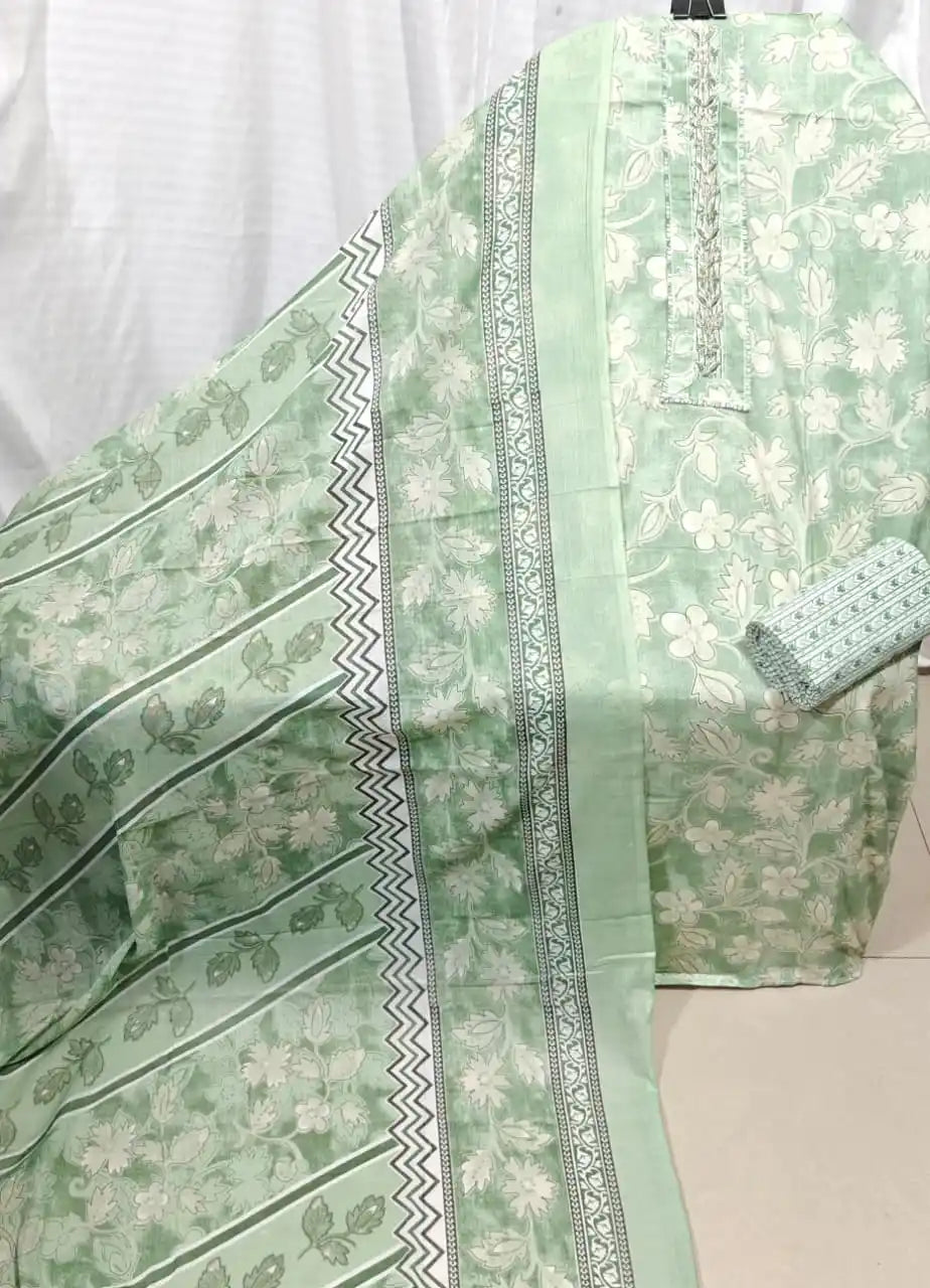 A fresh mint green cotton unstitched dress material by ASC, featuring an all-over soft floral silhouette print, an elegant embroidered neck border, and a matching dupatta styled with zig-zag and leaf patterns.