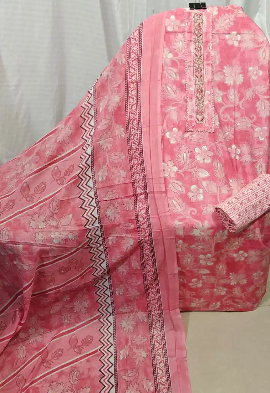 A vibrant rose pink cotton unstitched dress material by ASC, highlighting all-over white and pink floral patterns, an intricate matching embroidered neck strip, and a soft pink dupatta with chevron and floral borders.