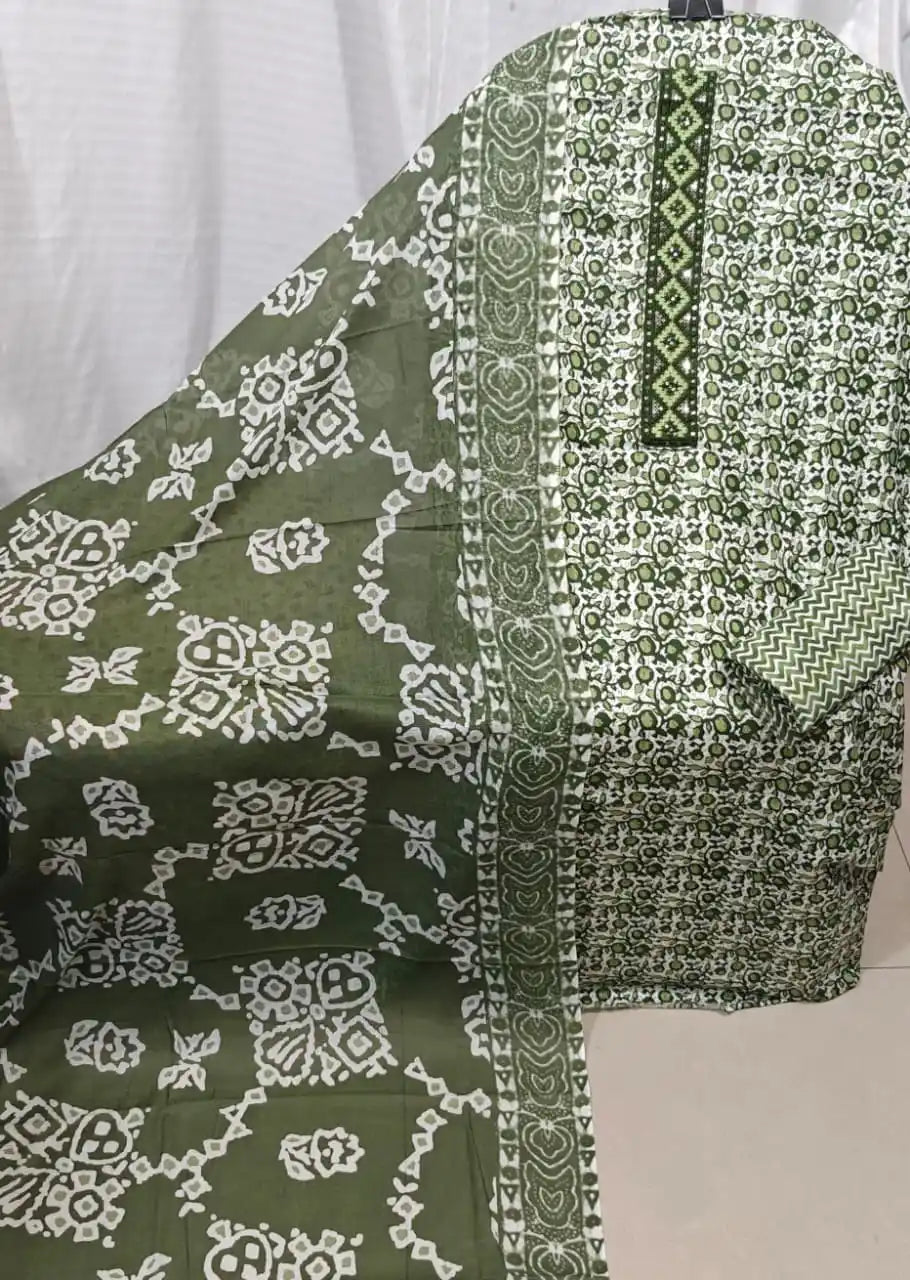 A premium olive green cotton unstitched suit material by ASC, featuring a dense micro floral jaal pattern on the kurta, a contrasting dark green embroidered neck patch with subtle sequins, and a distinct olive green dupatta with white batik-style geometric prints.