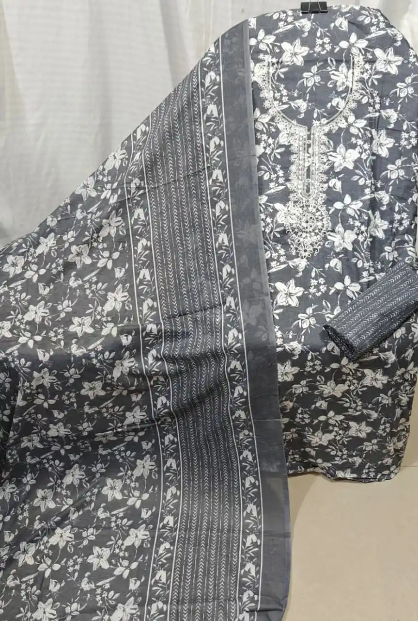 A sophisticated slate grey cotton unstitched dress material by ASC, highlighted by an all-over white floral jaal pattern, a detailed white thread work embroidery panel around the neck, and a matching grey dupatta with crisp white border accents.