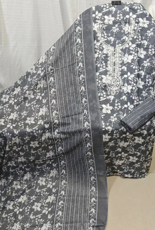 A sophisticated slate grey cotton unstitched dress material by ASC, highlighted by an all-over white floral jaal pattern, a detailed white thread work embroidery panel around the neck, and a matching grey dupatta with crisp white border accents.