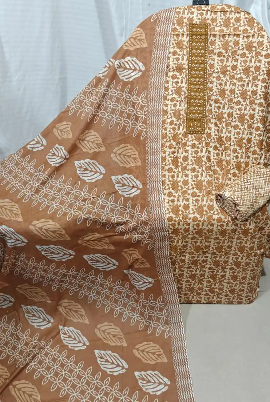 A neat presentation of a khaki brown cotton unstitched suit material by ASC, displaying an intricate light brown micro floral jaal, a long embroidered neck patch, and a matching brown dupatta detailed with white leaf graphics.