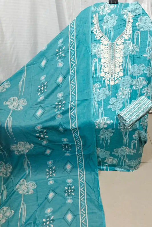 A beautiful teal blue cotton unstitched dress material by ASC, featuring a unique white sketch-style floral print on the shirt, a heavily detailed white thread embroidery neck panel, a fine geometric zigzag patterned bottom fabric, and a matching teal dupatta adorned with elegant floral stems and diamond borders.