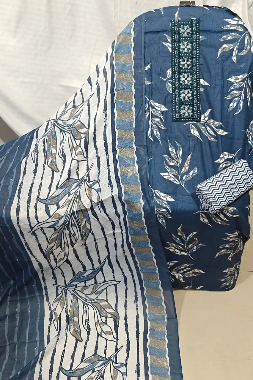 A classic navy blue cotton unstitched dress material by ASC, featuring a micro leaf texture print on the shirt fabric, a dark blue embroidered neck panel, a chevron print bottom fold, and a coordinated white dupatta showcasing navy blue stripes and bold leaf block prints.