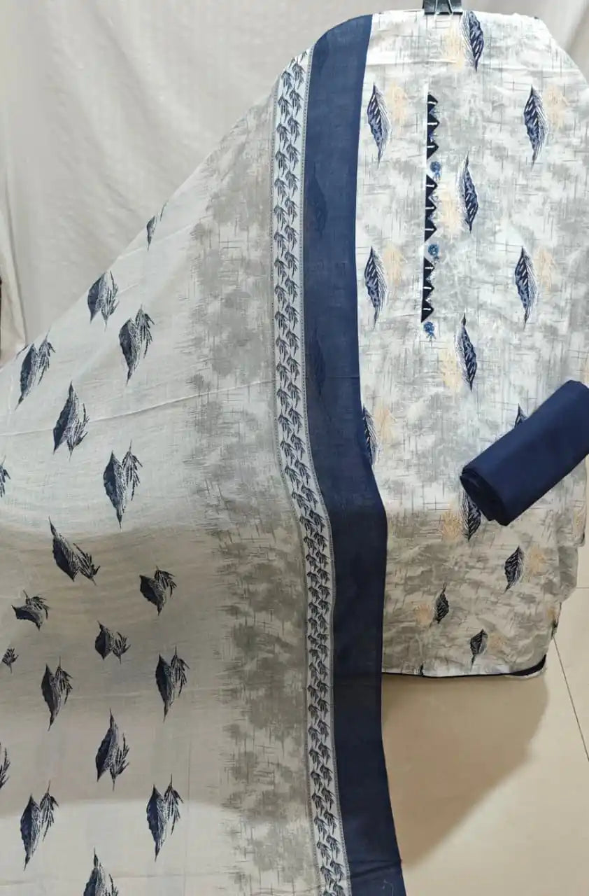 An elegant light grey and navy blue cotton unstitched suit fabric by ASC, displaying a textured cross-hatch base with floating blue leaf motifs, a dark blue embroidered neck strip with geometric zig-zag lace trim, a solid navy bottom fold, and a coordinated dupatta with matching navy borders.