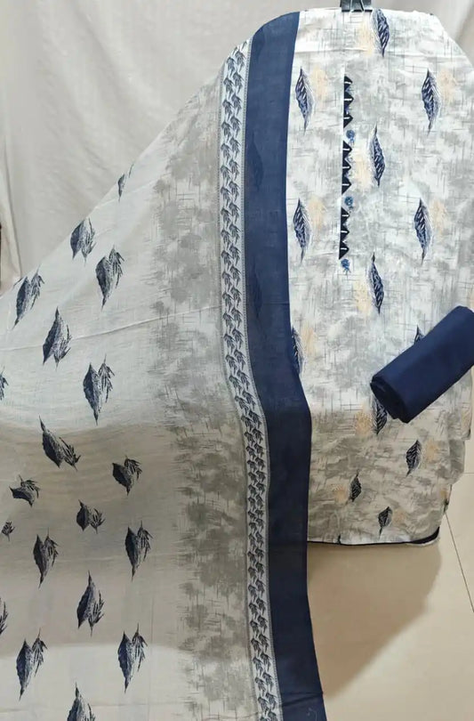 An elegant light grey and navy blue cotton unstitched suit fabric by ASC, displaying a textured cross-hatch base with floating blue leaf motifs, a dark blue embroidered neck strip with geometric zig-zag lace trim, a solid navy bottom fold, and a coordinated dupatta with matching navy borders.