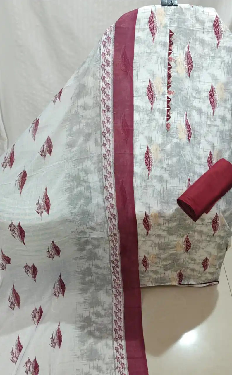 A sophisticated light grey and maroon cotton unstitched dress material by ASC, highlighted by a subtle textured backdrop with floating maroon feather-leaf prints, an intricate embroidered neck panel, a solid maroon bottom cloth, and a matching dupatta with wide maroon side borders.