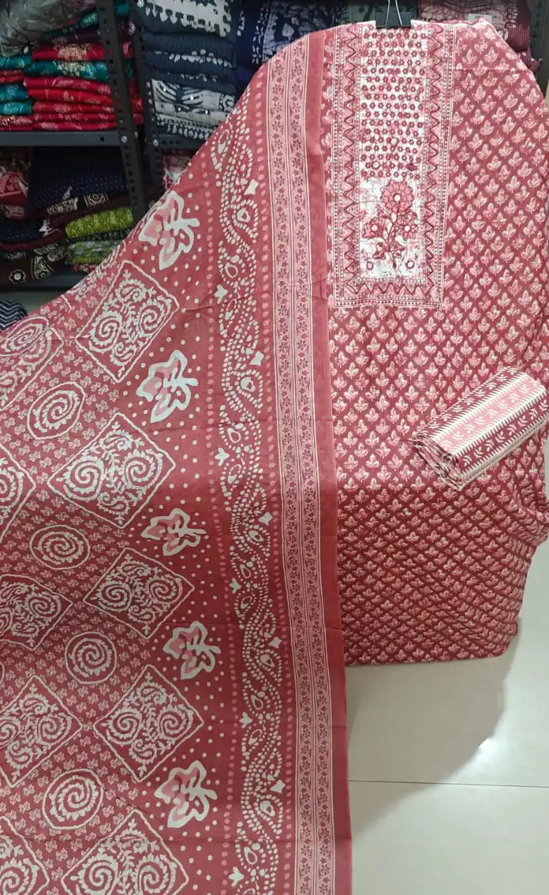 Rust red block print cotton suit featuring intricate block motifs and floral threadwork, complete with matching dupatta.