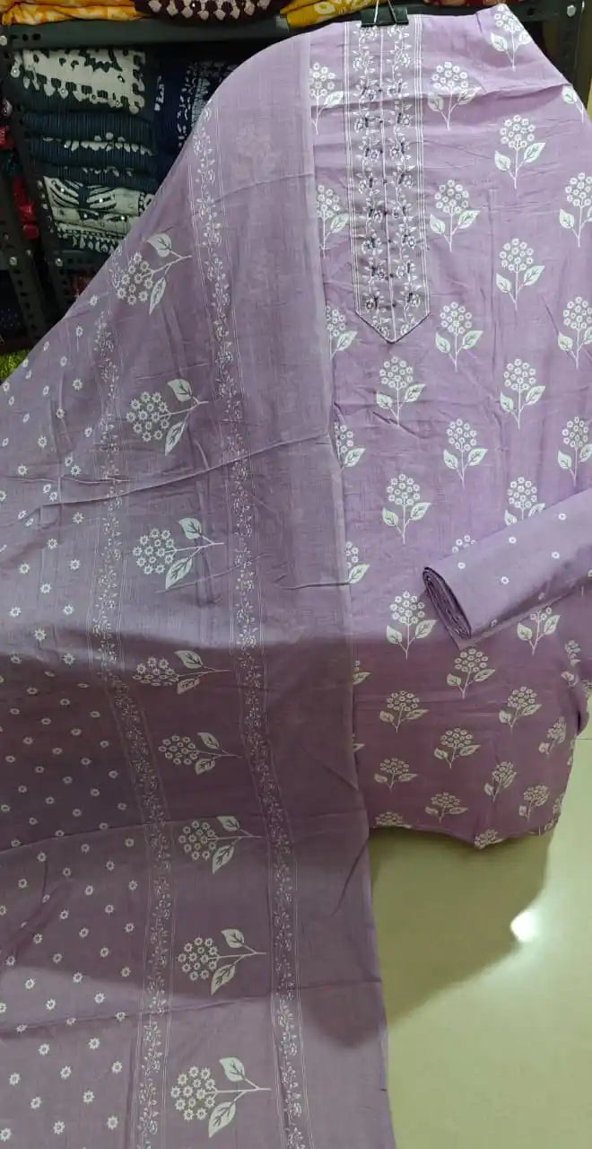 Pastel unstitched suit with clean botanical prints and neck embroidery.