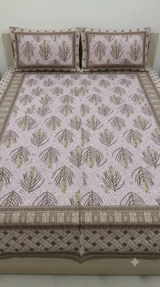 Mauve fern double bedsheet set displayed with two matching pillow covers on a bed.