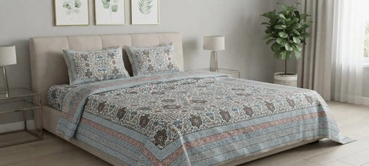 Traditional floral super king bedsheet displayed on a stylish bed with coordinated pillows and decorative plant.