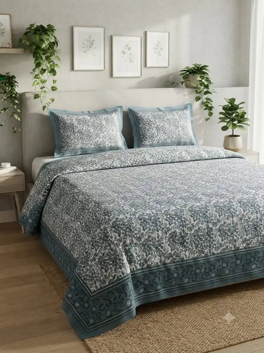 Jaipuri cotton super king bedsheet in blue and white floral design, enhancing bedroom decor.