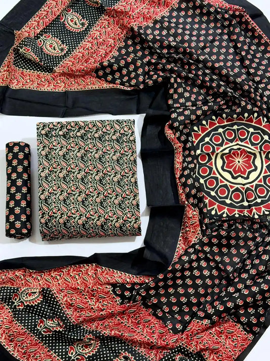 An elegant jet black rayon unstitched dress material by ASC, showcasing intricate red and cream Ajrakh paisley prints, a printed bottom piece, and a graceful dupatta featuring a prominent central mandala motif framed by detailed block-printed borders.