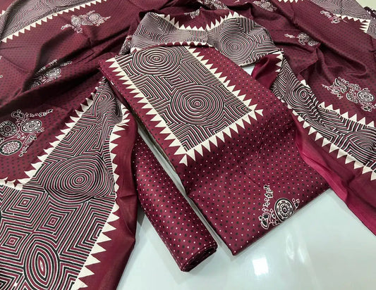 A deep maroon rayon unstitched dress material by ASC, showcasing a micro polka dot pattern on the kurta, a highlighted concentric circle geometric neck panel with saw-tooth edging, and a matching full-length dupatta.