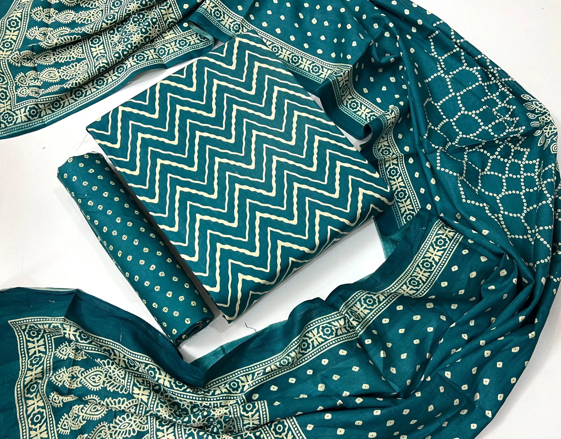 Teal blue rayon unstitched salwar suit with traditional cream wave pattern hand ajrakh block print, matching dupatta, and bottom fabric.