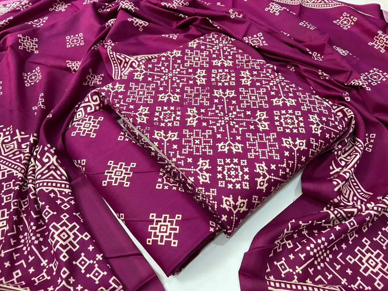 Ajrakh print wine pink rayon unstitched suit material featuring traditional cross-stitch geometric block designs and a matching dupatta by ASC Fashion Store.