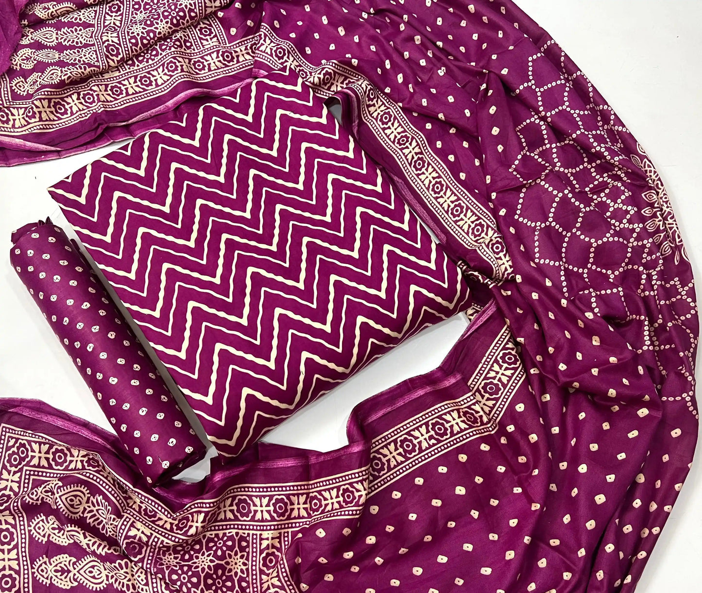 Vibrant magenta pink unstitched rayon suit material with elegant wave ajrakh print and coordinating dupatta for women.
