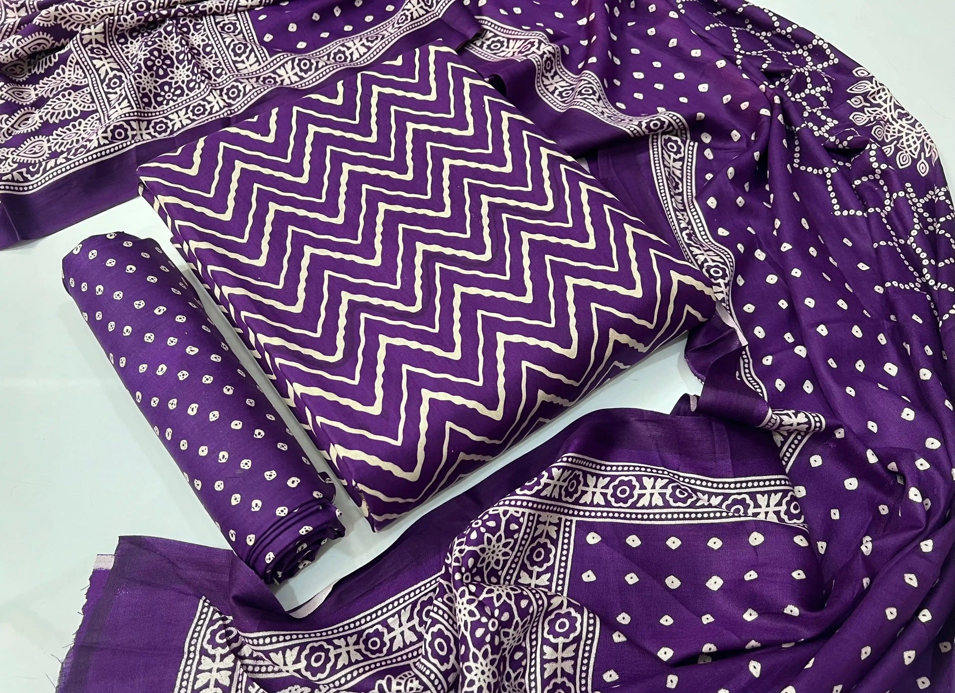 Royal purple unstitched rayon salwar suit set showcasing traditional wave-style handblock ajrakh print with full-length dupatta.