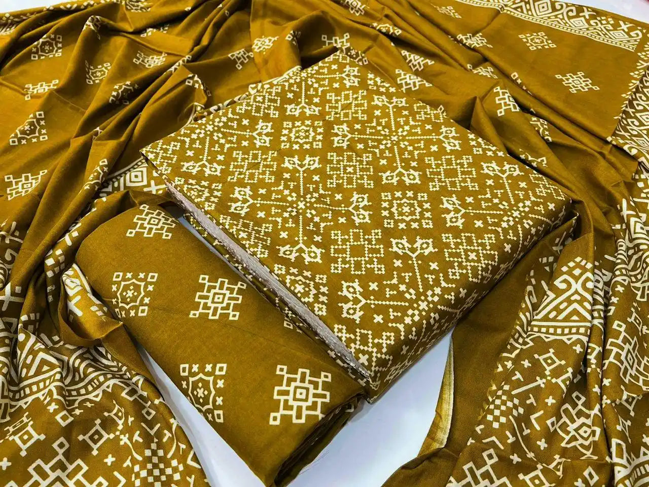 Mustard yellow unstitched rayon dress material with intricate geometric mandala ajrakh handblock print and matching printed dupatta.