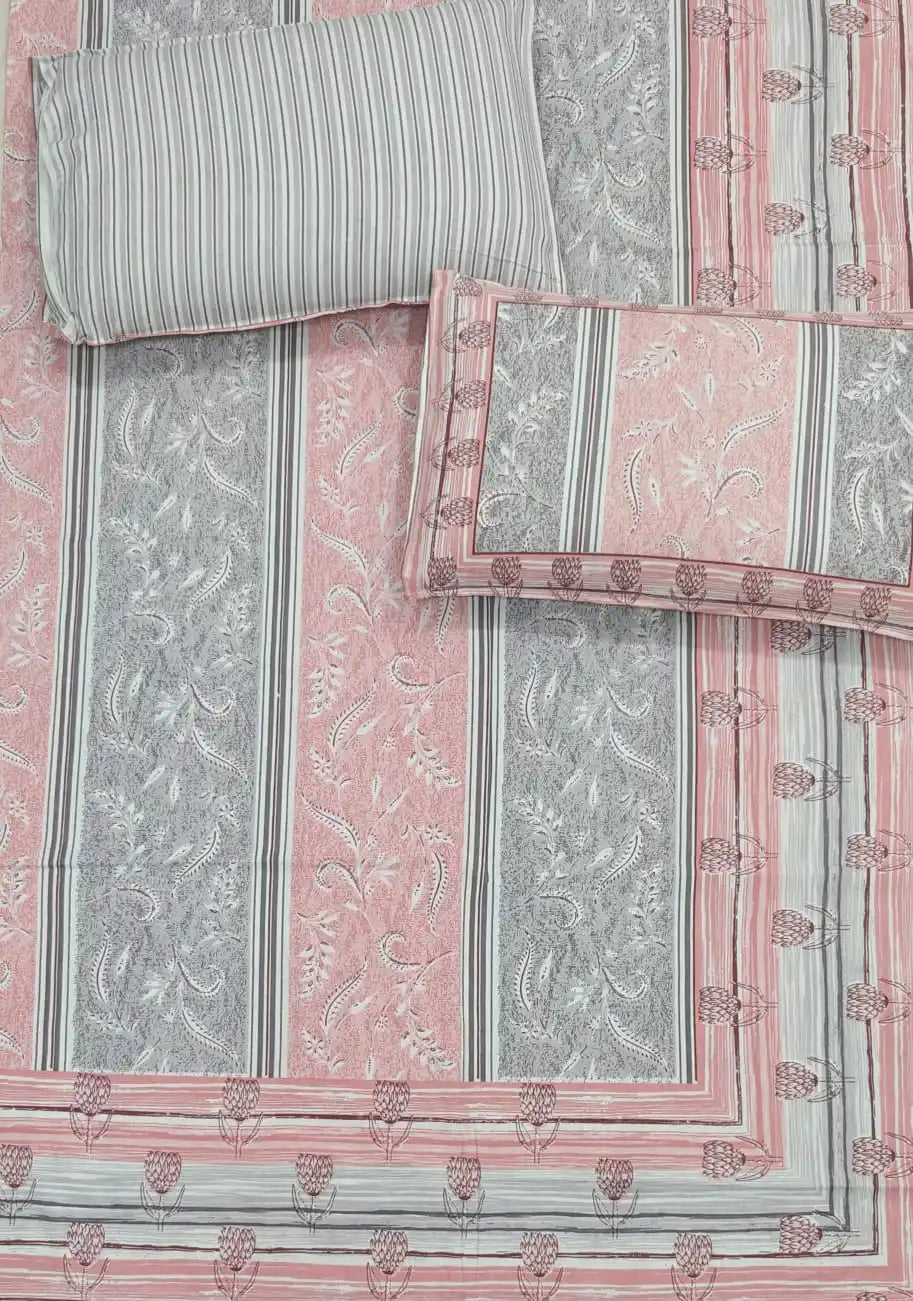 Jaipuri cotton bedsheet with pillow covers showing intricate Sanganeri hand block print in pink and grey.