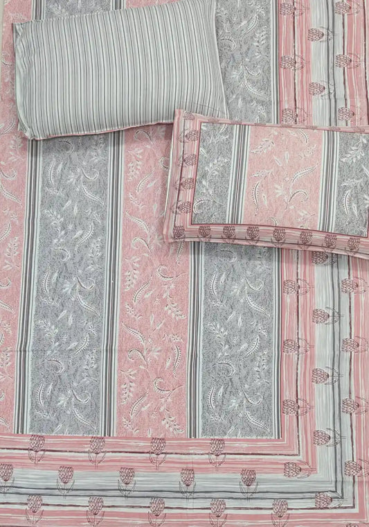 Jaipuri cotton bedsheet with pillow covers showing intricate Sanganeri hand block print in pink and grey.