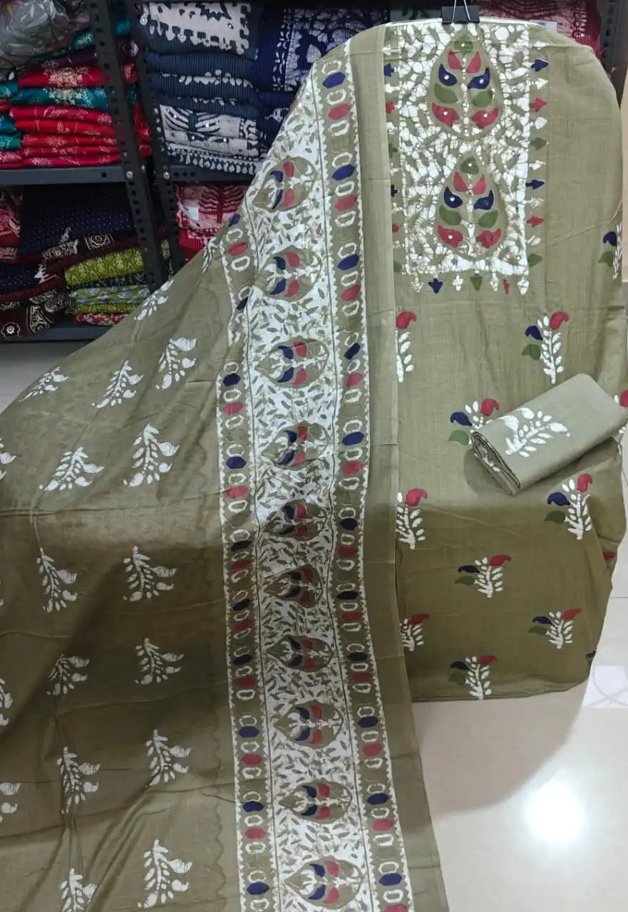 Traditional khaki brown cotton unstitched suit featuring a bold batik embroidered neckline panel.