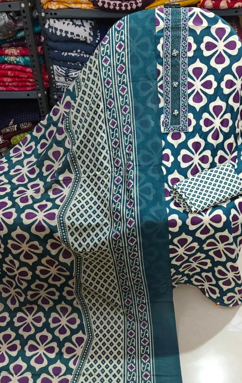 Striking teal blue and purple unstitched suit with modern geometric patterns.