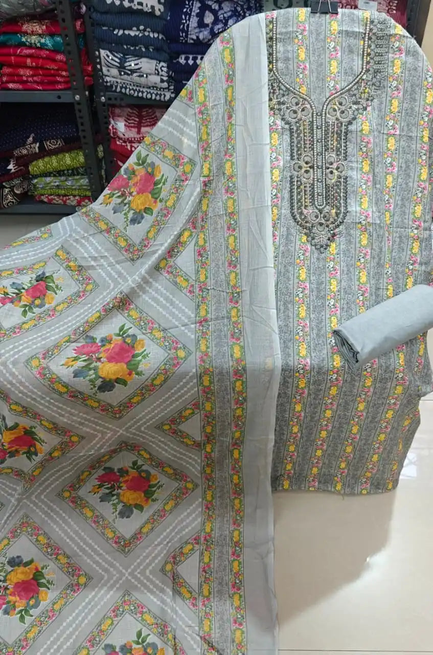 Elegant light grey unstitched cotton suit featuring traditional vertical floral borders.