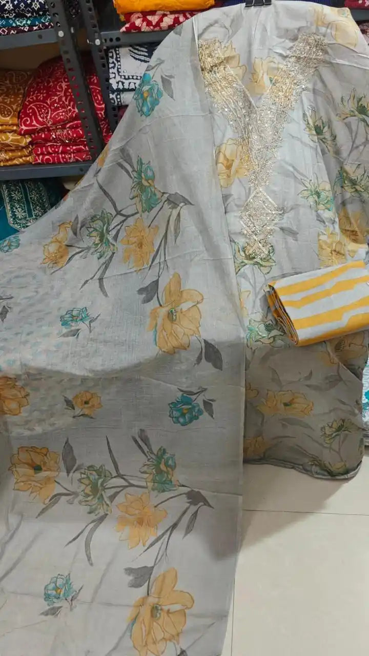 Grey cotton suit with yellow floral prints, an embroidered neckline, and a striped bottom.