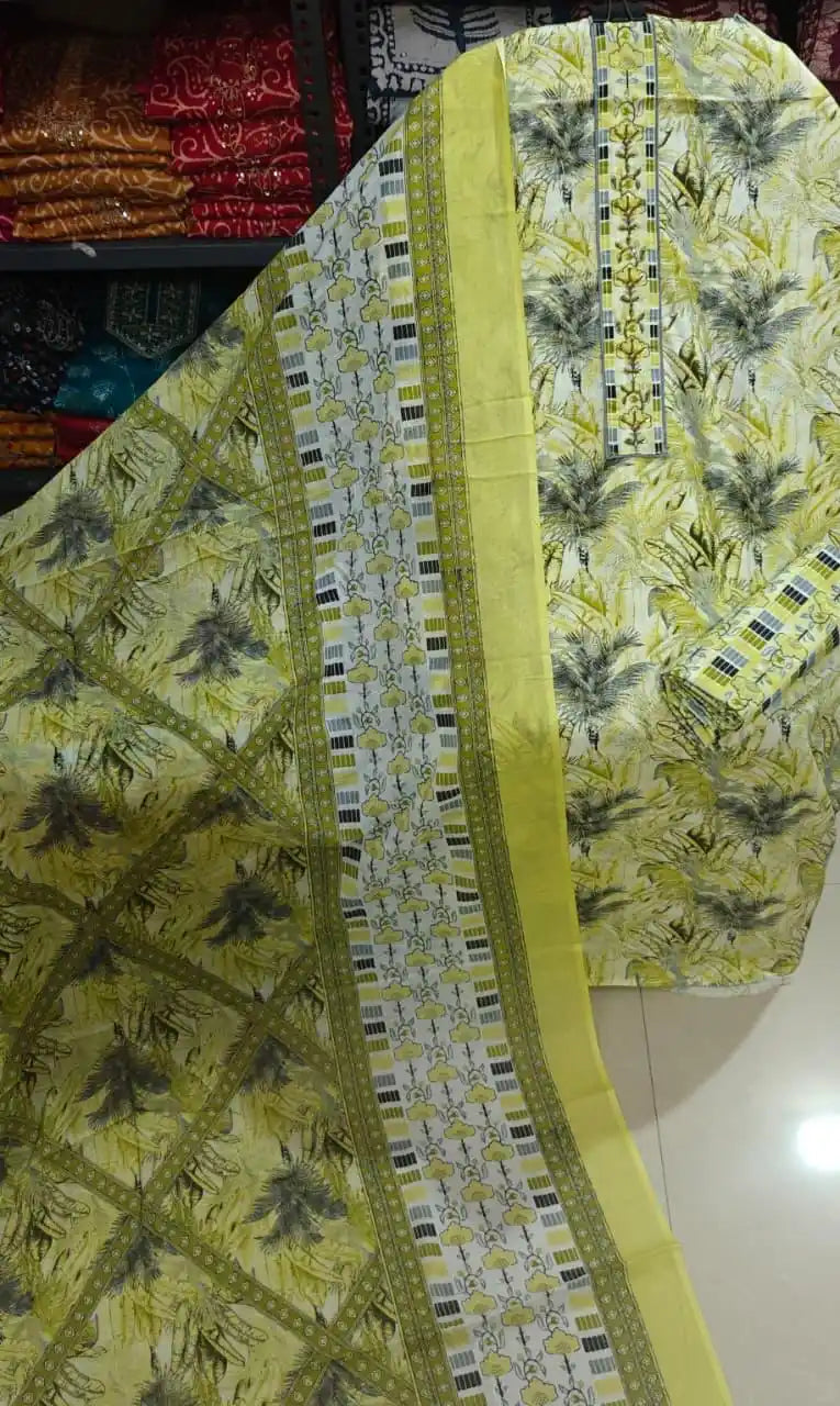 Bright lime green and white cotton suit with detailed tropical foliage prints and a matching border dupatta.