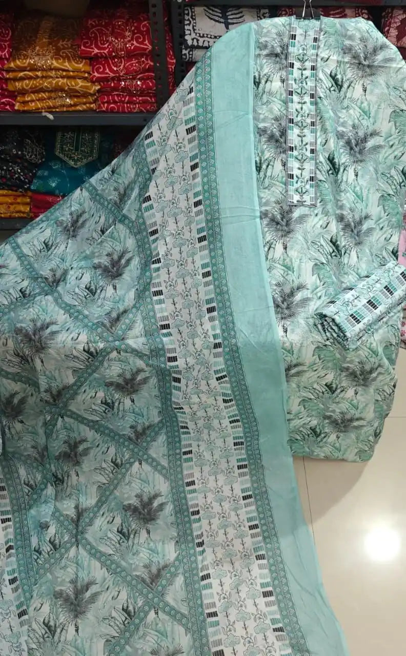 Refreshing mint green tropical print cotton suit with a structured block pattern dupatta.