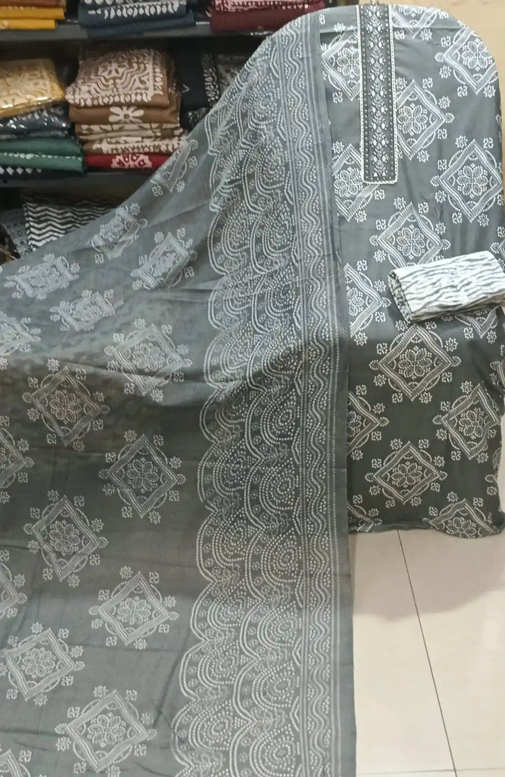 Charcoal grey cotton salwar suit with white geometric block print patterns and a matching wave-bordered dupatta.